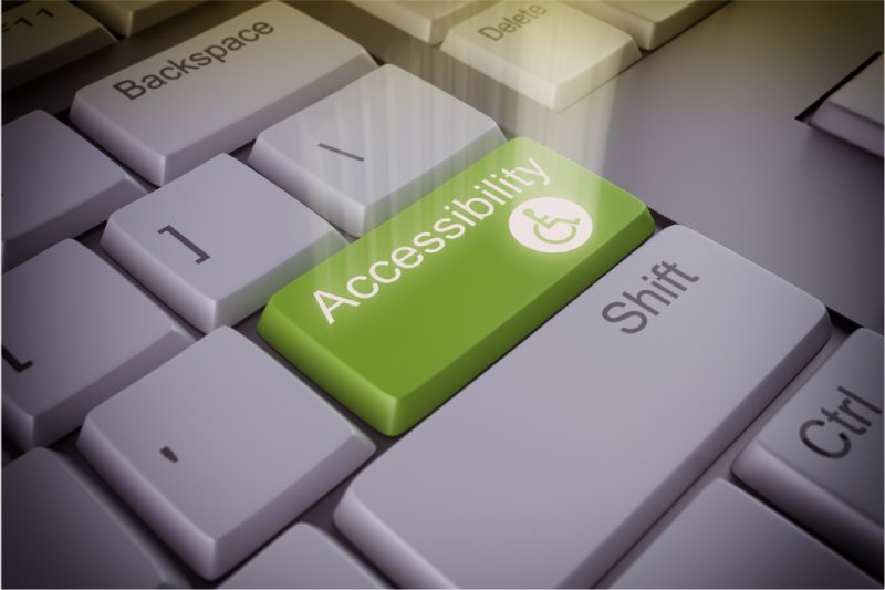 Green accessibility key on a keyboard, symbolizing digital accessibility